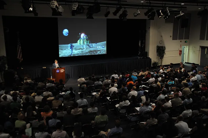 Original photo: A conference in a lecture hall